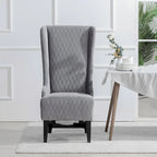 Fauteuil d'appoint en velours capitonné avec haut dossier à oreilles et pieds en bois
