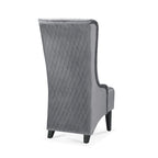 Fauteuil d'appoint en velours capitonné avec haut dossier à oreilles et pieds en bois